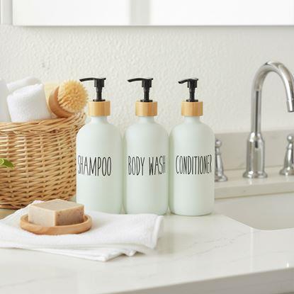 Obraz Dozowniki do łazienki na szampon, odżywkę i żel pod prysznic